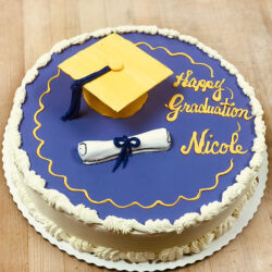 Graduation cake with cap and diploma