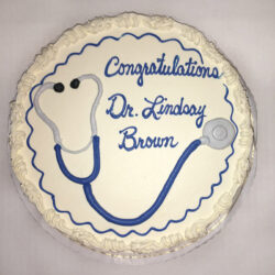 Graduation cake with stethoscope and writing